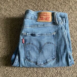 Levi's Mid Rise Skinny Jeans in Medium Blue Denim